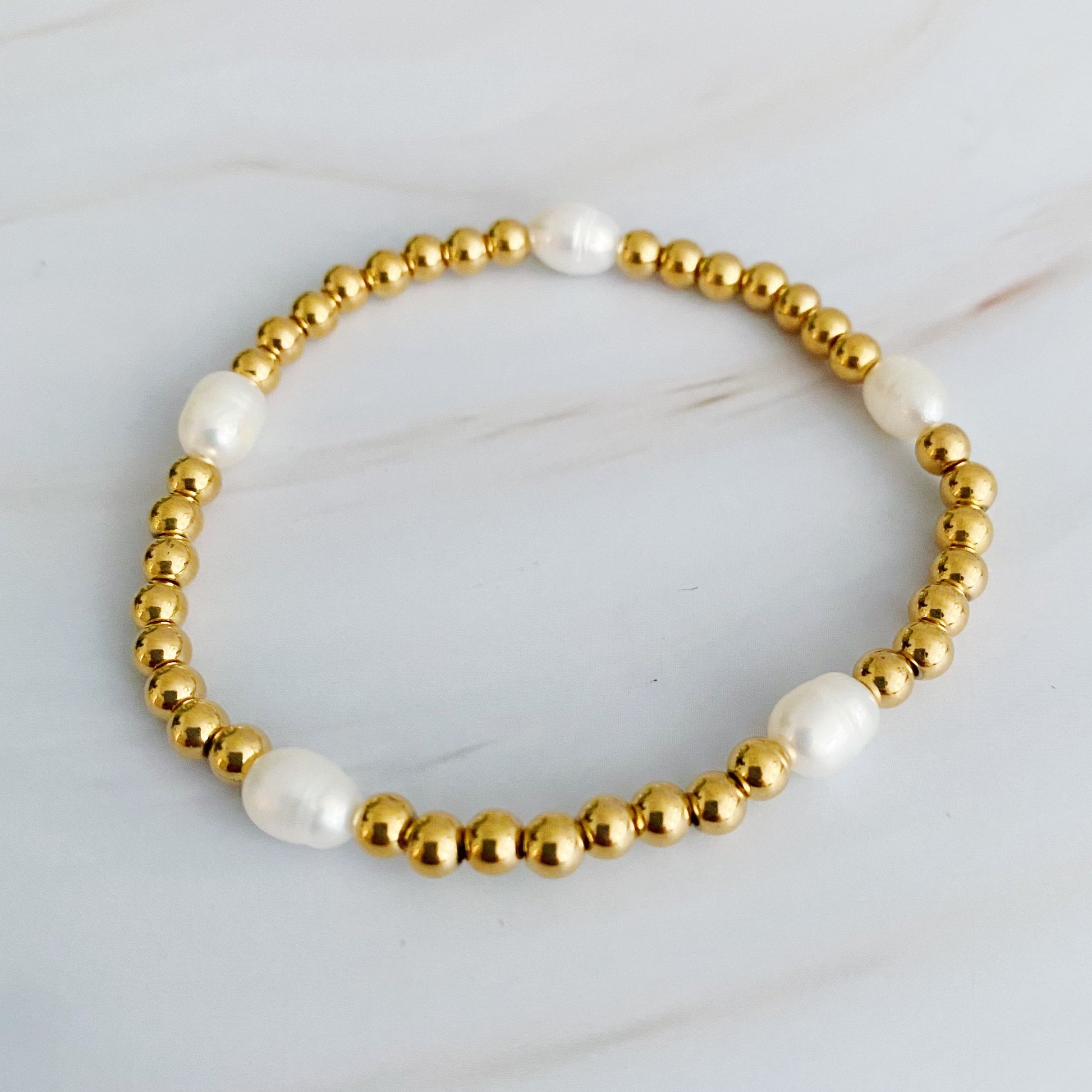 Elegant Golden Bauble Bracelets Adorned with Exquisite Freshwater Pearls